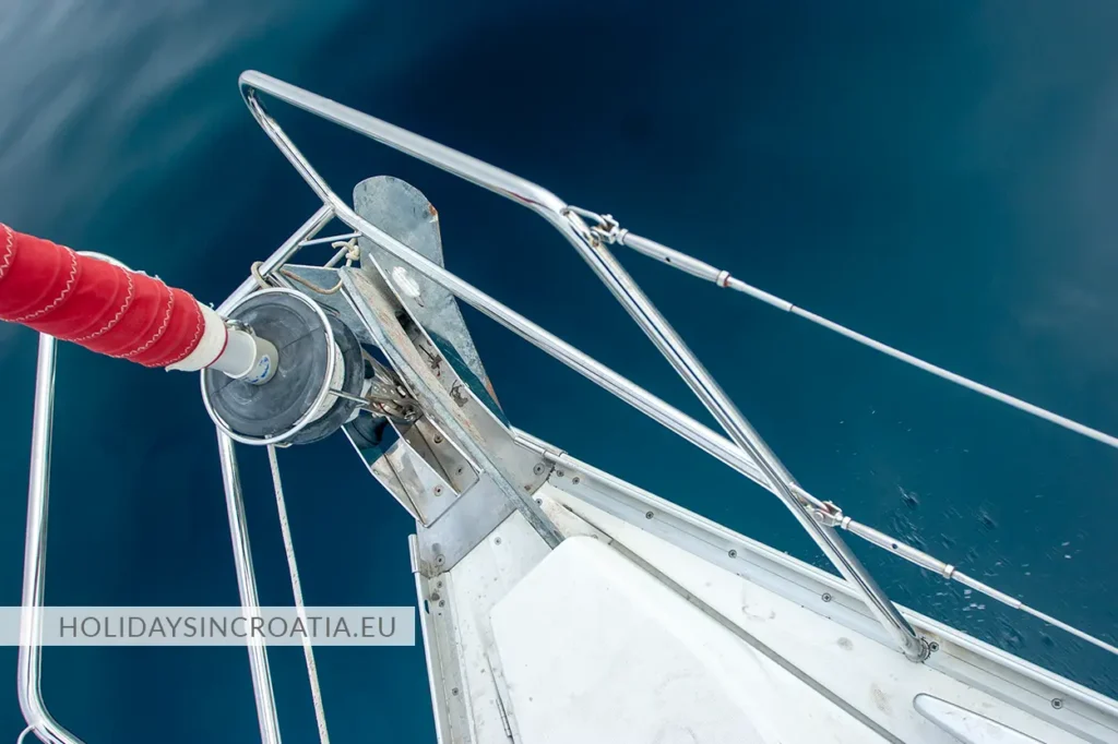 Bow of a sailboat above deep blue Adriatic Sea