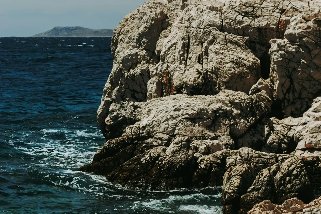 Rocky coastline and deep blue sea on Murter island, Croatia